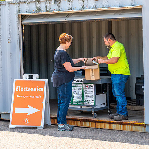 Customer recycling electronics at the Drop-Off Center in Williston.