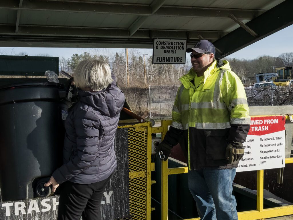 CSWD staff at the South Burlington Drop-Off Center with their regular customers by the trash compactor, 