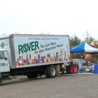 A large truck in a parking lot with the words "Rover The Safe Place for your Hazardous Waste" on the side of the truck